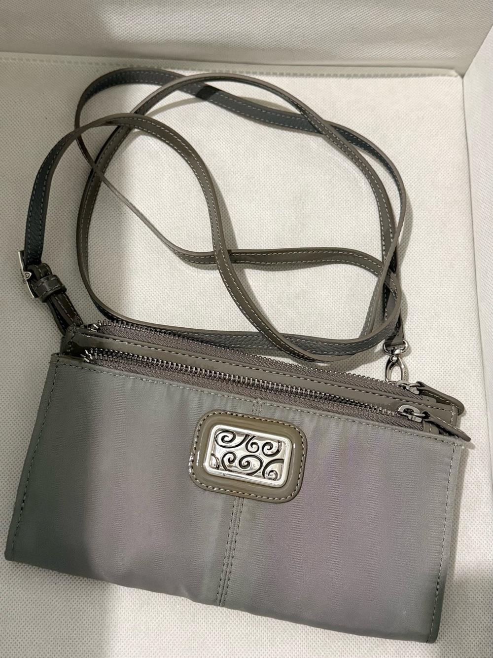 Brighton Gray Women’s Crossbody Wallet with Decorative Metal Accent